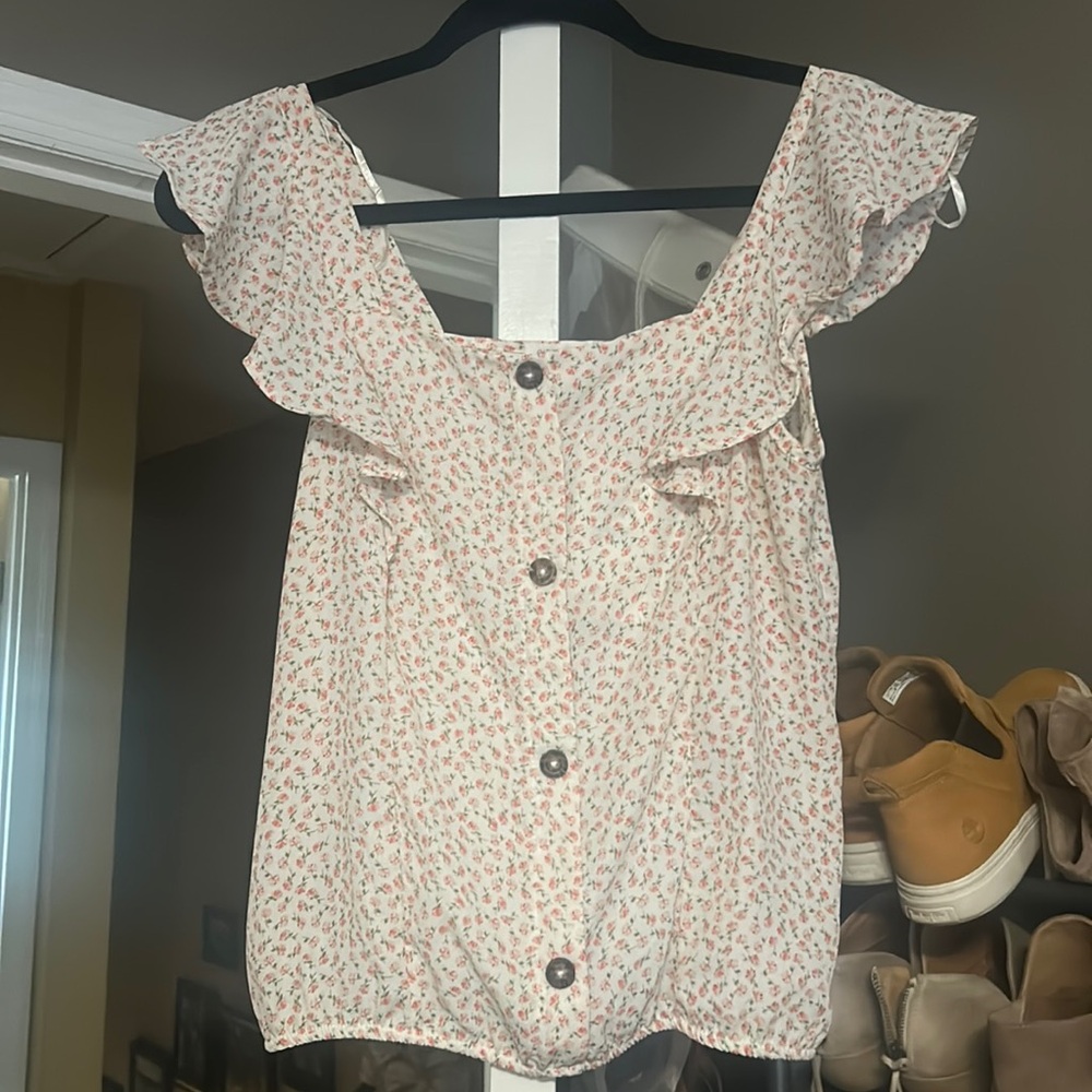 Small flower tank, semi crop, meets waistband style. Small elastic at hem.